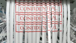 shredded paper with the word confidential on it